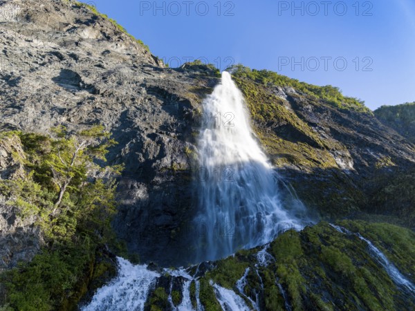 Waterfall at the Bay of Last Hope, fjords and mountains, Puerto Natales, Patagonia, Chile, South America