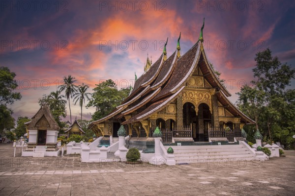 Lovely sunset at a lovely temple in Luang Prabang in summer, Laos, Asia
