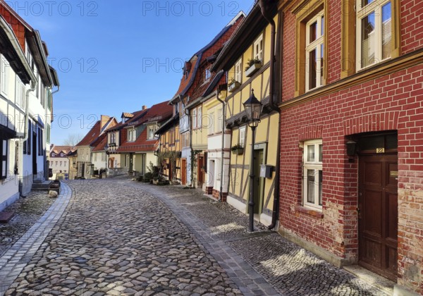 Half-timbered houses with cobblestones in Wassertorstraße, Old Town of the World Heritage City of Quedlinburg, Saxony-Anhalt, Germany, Europe