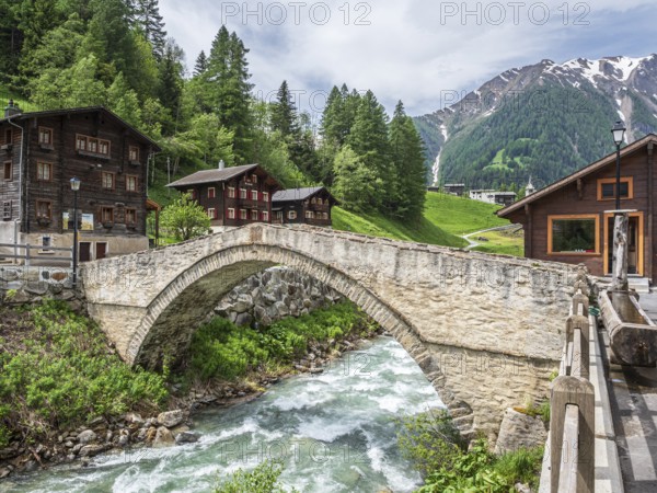 Village Binn, bridge over river Binna, traditional wooden houses, church, Valais, Switzerland, Europe