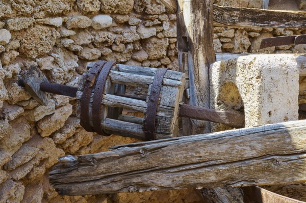 Close-up of a wooden cogwheel component in an old stone building ruin, windmill, ruin, near Lindos, Lindos, Rhodes, Dodecanese, Greek Islands, Greece, Europe