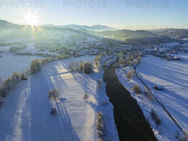 Aerial view of a river and a village in front of mountains, winter, evening light, Großweil, Alpine foothills, Upper Bavaria, Bavaria, Germany, Europe