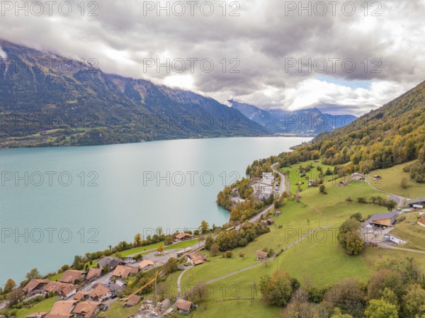 Sweeping views over a large lake with surrounding mountains, villages and meadows, Lake Brienz. Switzerland