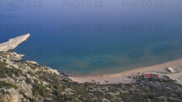 Aerial view of a secluded beach with clear blue water and rocky surroundings, Tsambika Beach, Tsambika, Rhodes, Dodecanese, Greek Islands, Greece, Europe