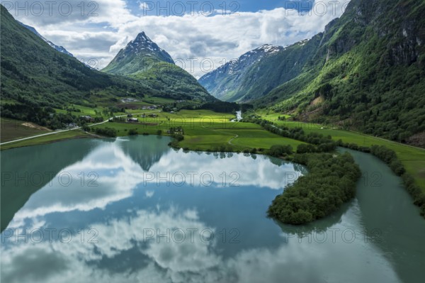 Mountain Eggenipa reflected in lake Bergheimsvatnet, south of Byrkjelo, Norway, Europe