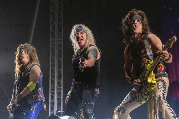Copenhagen, Denmark - 19.6.2024: Spyder (bassist), Michael Starr (singer) and Satchel (guitarist) from the band Steel Panther at the Copenhell Metal Festival at Kløverparken Camping Copenhagen, Denmark. The festival will take place from 19-22 June 2024