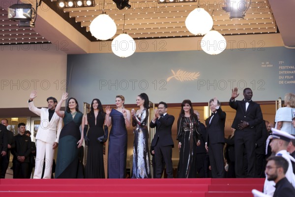 Cannes, France, 25.5.2024: Jury members Pierfrancesco Favino (Italian actor), Lily Gladstone (US actor), Nadine Labaki (Lebanese director), Greta Gerwig (US director), Eva Green (French actress), Juan Antonio Bayona (Spanish director and producer), Ebru Ceylan (Turkish screenwriter and photographer), Kore-Eda Hirokazu (Japanese producer), Omar Sy (French actor and comedian) and Iris Knobloch (President of the Cannes International Film Festival) at the closing ceremony on the red carpet of the Palais des Festivals during the 77th Cannes International Film Festival. Cannes International Film Festival. The 77th Cannes International Film Festival will take place from 14 to 25 May 2024, Europe