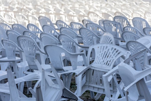 Seating for outdoor event, rows of chairs, overturned garden chairs made of plastic, plastic, monobloc design, disturbed order, clutter, Butzbach, Wetterau, Hesse, Germany, Europe