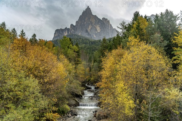 Autumn at the Schwarzgriesbach stream and the Schlern mountain in Seis am Schlern, South Tyrol, Italy, Europe