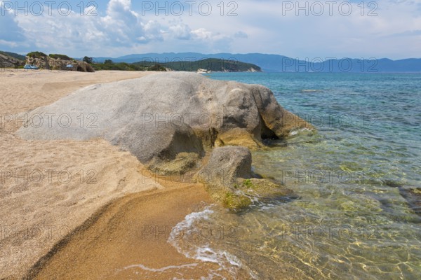 Rocky beach with clear sea water and gentle waves, surrounded by nature, beach, rocks in the shape of an elephant, Kakoudia, Ierissos, Sithonia, Halkidiki, Central Macedonia, Greece, Europe