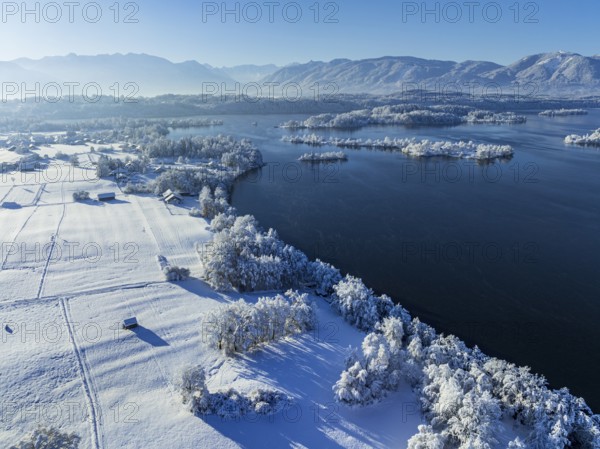 Aerial view of a lake in front of mountains, winter, snow, morning light, fog, Staffelsee, Alpine foothills, Upper Bavaria, Bavaria, Germany, Europe