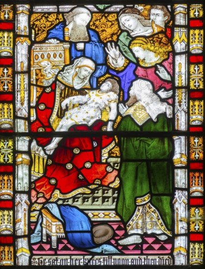 Detail of stained glass east window church of All Saints, Rede, Suffolk, England, UK, 2 Kings 4:20 servant child dies on mother's lap