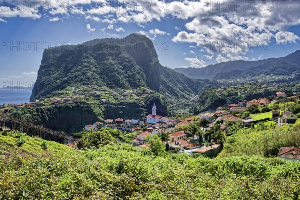 The village of Faial with a view of the landmark Eagle Rock from the Miradouro do Fortim viewpoint, Madeira, Portugal, Europe