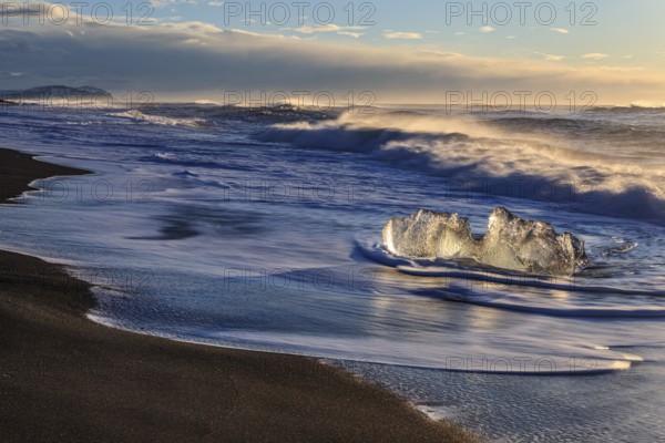 Ice floes on the beach, waves, sunny, morning mood, winter, Diamond Beach, Breidamerkursandur, Jökulsarlon, Iceland, Europe