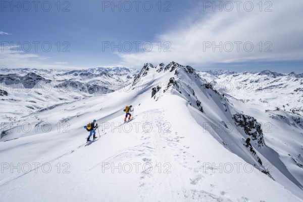 Two ski tourers in mountain landscape with snow, mountain panorama with summit of the Grisons Alps, ascent to the Scalettahorn, Grisons Haute Route, Albula Alps, Rhaetian Alps, Grisons, Switzerland, Europe