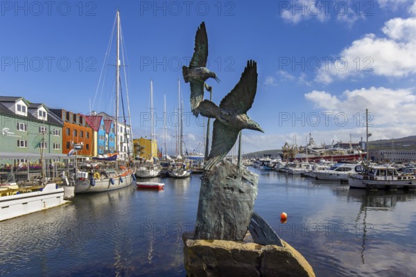Battle of the Birds sculpture, tribute to Nólsoyar Páll, 18th century Faroese national hero in the harbour of Tórshavn, Thorshavn port, Faroe Islands, Europe