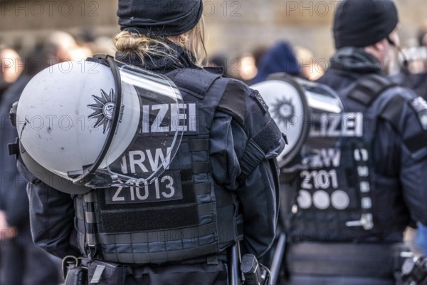 Police officers of a riot squad, riot police, with helmet and riot suit at a left-right demonstration in Essen, North Rhine-Westphalia, Germany, Europe