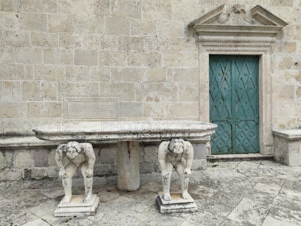 Table supported by stone sculptures, Island of Mary of the Rock, Gospa od Skrpjela, World Natural and Cultural Heritage Site, Bay of Kotor, Adriatic Sea, Mediterranean, Montenegro, Balkans, Europe