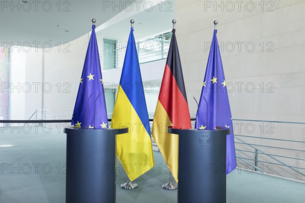 Flags of the European Union (EU), Ukraine and the Federal Republic of Germany in front of the joint press statement by Volodymyr Zelensky (President of Ukraine) and Olaf Scholz (Chancellor of the Federal Republic of Germany) at the Federal Chancellery, 11 October 2024