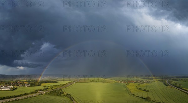 Thunderstorm cell with rainbow over fields near Krebs in the Osterzgebirge, Krebs, Saxony, Germany, Europe