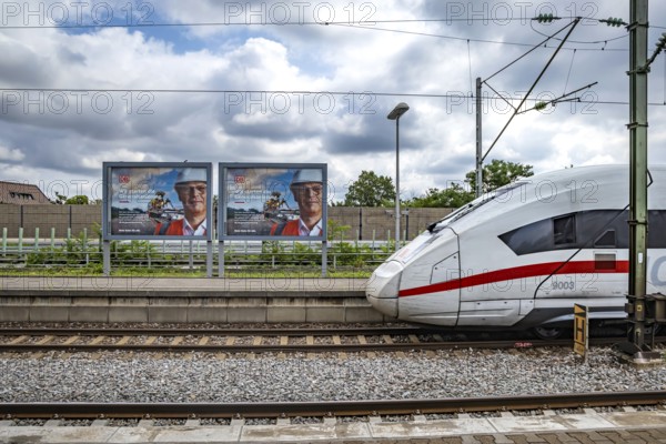 We are starting the general refurbishment. The railway wants to invest massively in tracks and infrastructure. Railway advertising posters with ICE trains at Zuffenhausen station, Stuttgart, Baden-Württemberg, Germany, Europe