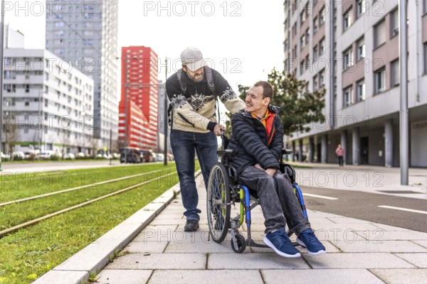 Caregiver assisting a young man with disability, strolling through a city environment, promoting inclusivity and support