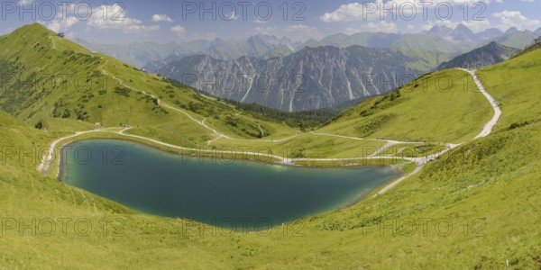 Riezler Alpsee, an artificial lake, snow pond, feeds the snow cannons that completely cover the slopes of the Fellhorn and Kanzelwand cable cars with snow, behind it the Fellhorn, 2038m, Allgäu Alps, Bavaria, Germany, Europe