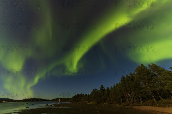 Northern lights, (Aurora borealis) at a lake near Kiruna, September 2024, Lapland, Sweden, Europe