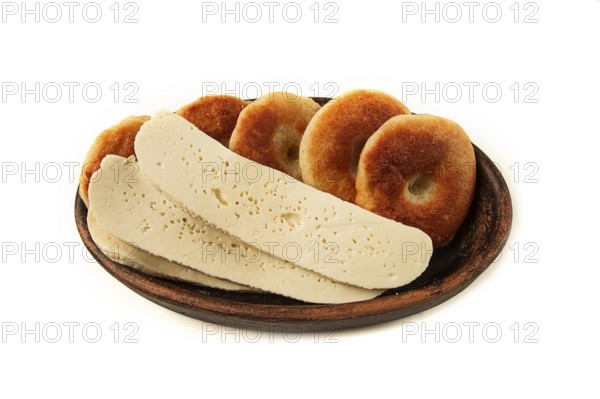 Mchadi, corn tortillas, traditional Georgian dish, corn bread, with Imeretian cheese, homemade, no people, on a light background