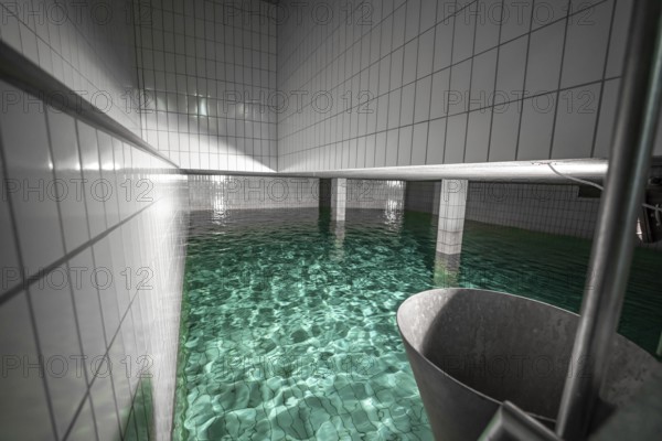 Large water basin with tiled walls and reflecting water, ENCW Netze Calw waterworks, Calw, Black Forest, Germany, Europe