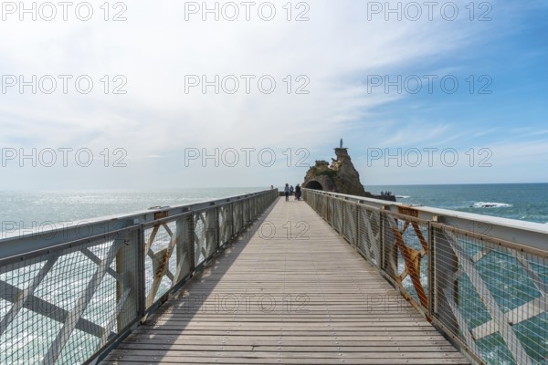 Wooden bridge together to Plage du Port Vieux in Biarritz, holiday in south-eastern France. Biarritz, department of Pyrenees-Atlantiques