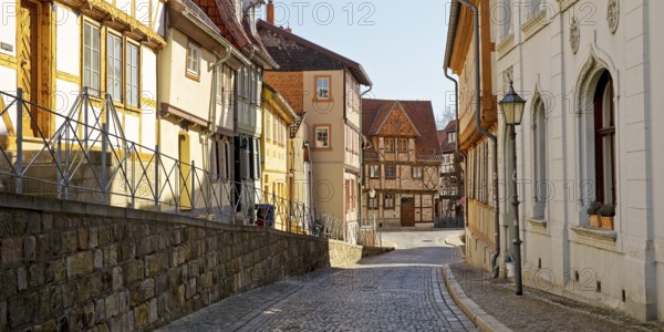 Half-timbered houses with cobblestones in Mühlenstraße, old town centre of the World Heritage town of Quedlinburg, Saxony-Anhalt, Germany, Europe