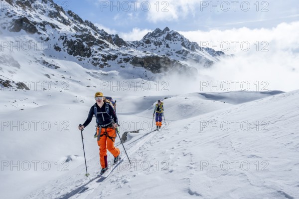 Ski tourers on the Bündner Haute Route, Albula Alps in winter, Rhaetian Alps, Graubünden, Eastern Switzerland, Switzerland, Europe