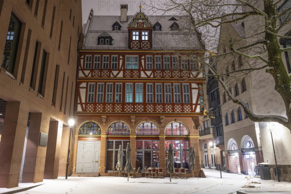 Snow lies in front of the Golden Scales, the most elaborately restored building in Frankfurt's New Old Town Frankfurt am Main, Hesse, Germany, Europe
