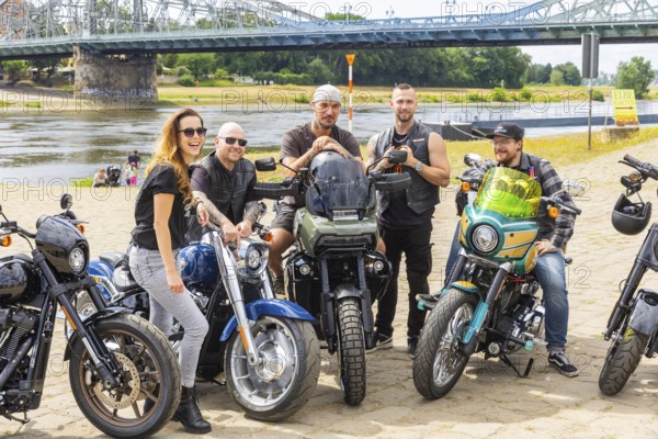 The tough guys are coming to town - view of Harley Days® Dresden 2024 chief organiser Daniela Hesse with her own bike. She is supported by several bikers, Harley Days® Dresden 2024, Dresden, Saxony, Germany, Europe