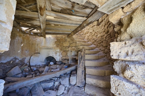 The interior of an old, abandoned mill with stone staircase and decaying wooden beams, windmill, ruin, near Lindos, Lindos, Rhodes, Dodecanese, Greek Islands, Greece, Europe