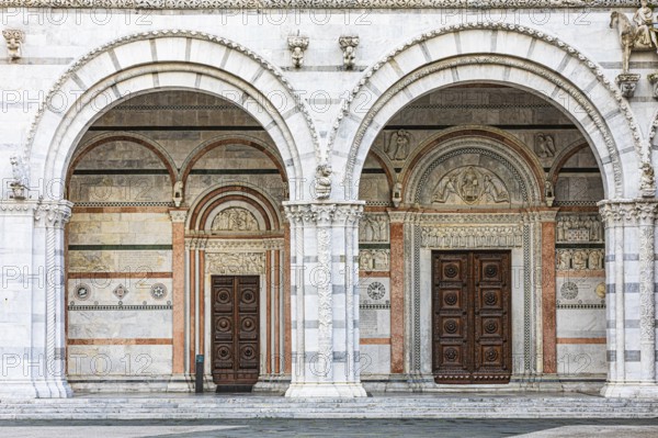 Arched entrance portals of the Cathedral of San Martino, historic city centre, Lucca, Tuscany, Italy, Europe