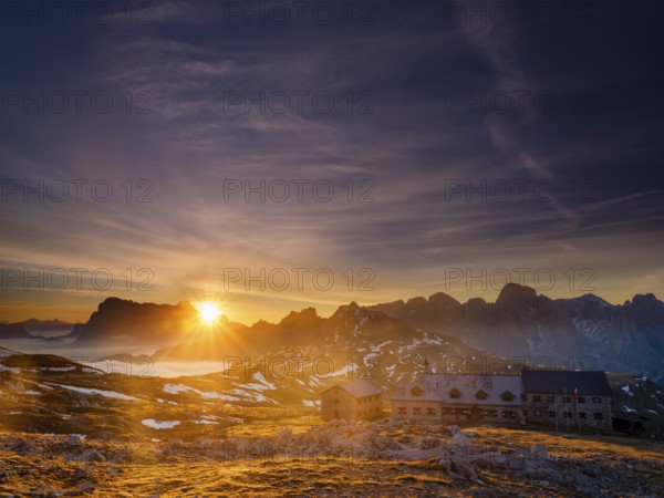 Schlernhaus at sunrise, Sassolungo Group and Catinaccio behind, Dolomites, Sciliar, South Tyrol, Italy, Europe
