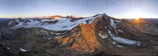 Atmospheric sunrise in a picturesque mountain landscape, alpenglow, aerial view, mountain hut Becherhaus at the summit Becher and glacier Übeltalferner, Stubai Alps, South Tyrol, Italy, Europe