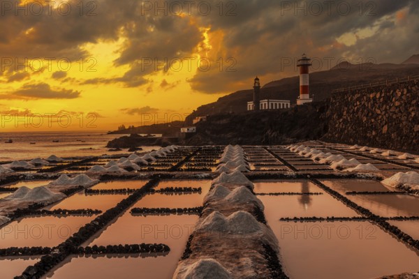Sunset at the Fuencaliente Lighthouse next to the salt flats, on the route of the volcanoes south of the island of La Palma, Canary Islands, Spain, Europe