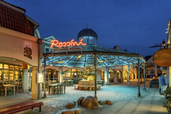 The Italian restaurant Rossini in the Baltic seaside resort of Kühlungsborn at dusk, Mecklenburg-Vorpommern, Germany, Europe
