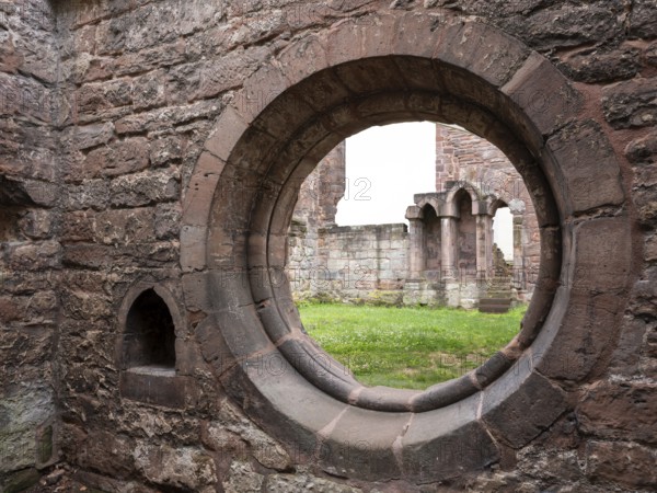 Round window opening at the ruins of the monastery church, former Cistercian nunnery, Stadtroda, Thuringia, Germany, Europe