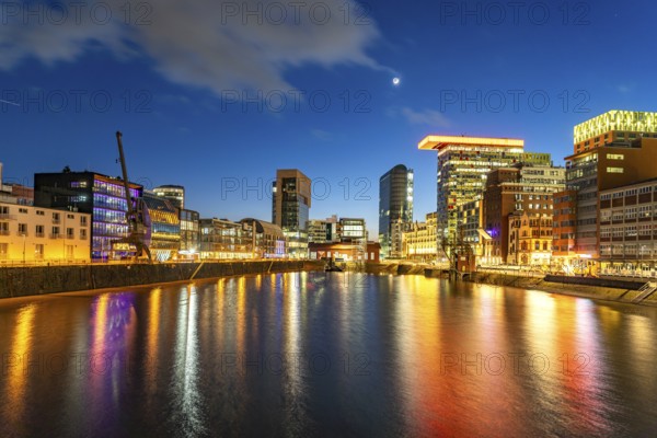 Modern high-rise architecture in the Media Harbour quarter in Düsseldorf at dusk, North Rhine-Westphalia, Germany, Europe