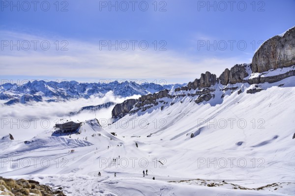 On the right the rock faces of the Hoher Ifen (2230 m) in Kleinwalsertal, on the left the mountain station of the Ifen mountain railway on the Gottesacker plateau, Allgäu, Vorarlberg, Austria, Europe