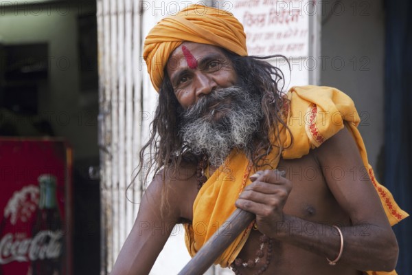 Close-up portrait of Hindu man wearing red bindi on forehead in Udaipur, Rajasthan, India, Asia