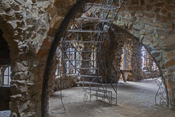 Rye, Colorado, An ornamental iron stairway in Bishop Castle. The Castle is an elaborate stone and metal structure and roadside attraction. It is being built by Jim Bishop in the mountains of San Isabel National Forest