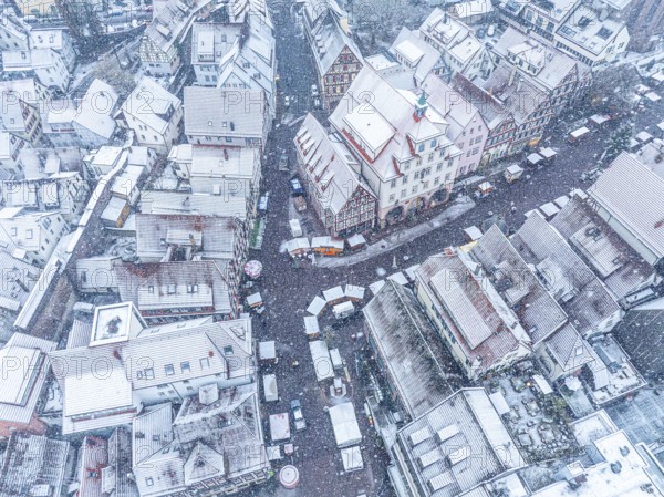 Winter aerial view of snow-covered streets and roofs of a small town, Black Forest, Calw, Germany, Europe
