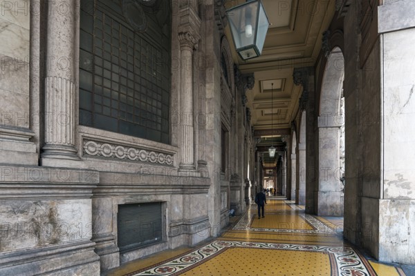 Arcaded walkway with mosaic floor from Palazzo della Borsa, built between 1907 and 1912, in Piazza de Ferrari, Genoa, Italy, Europe