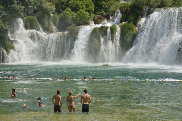Tourists taking a bath at the Skradinski buk waterfalls, Krka National Park, Šibenik-Knin County, Dalmatia, Croatia, Europe