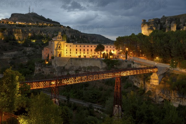 Illuminated Old Town of Cuenca with San Pablo High Bridge at dusk, Castilla-La Mancha Region, Spain, Europe